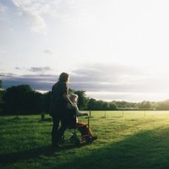 Carer with person in wheelchair