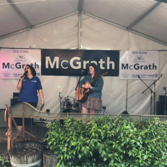 woman performing on stage at music festival